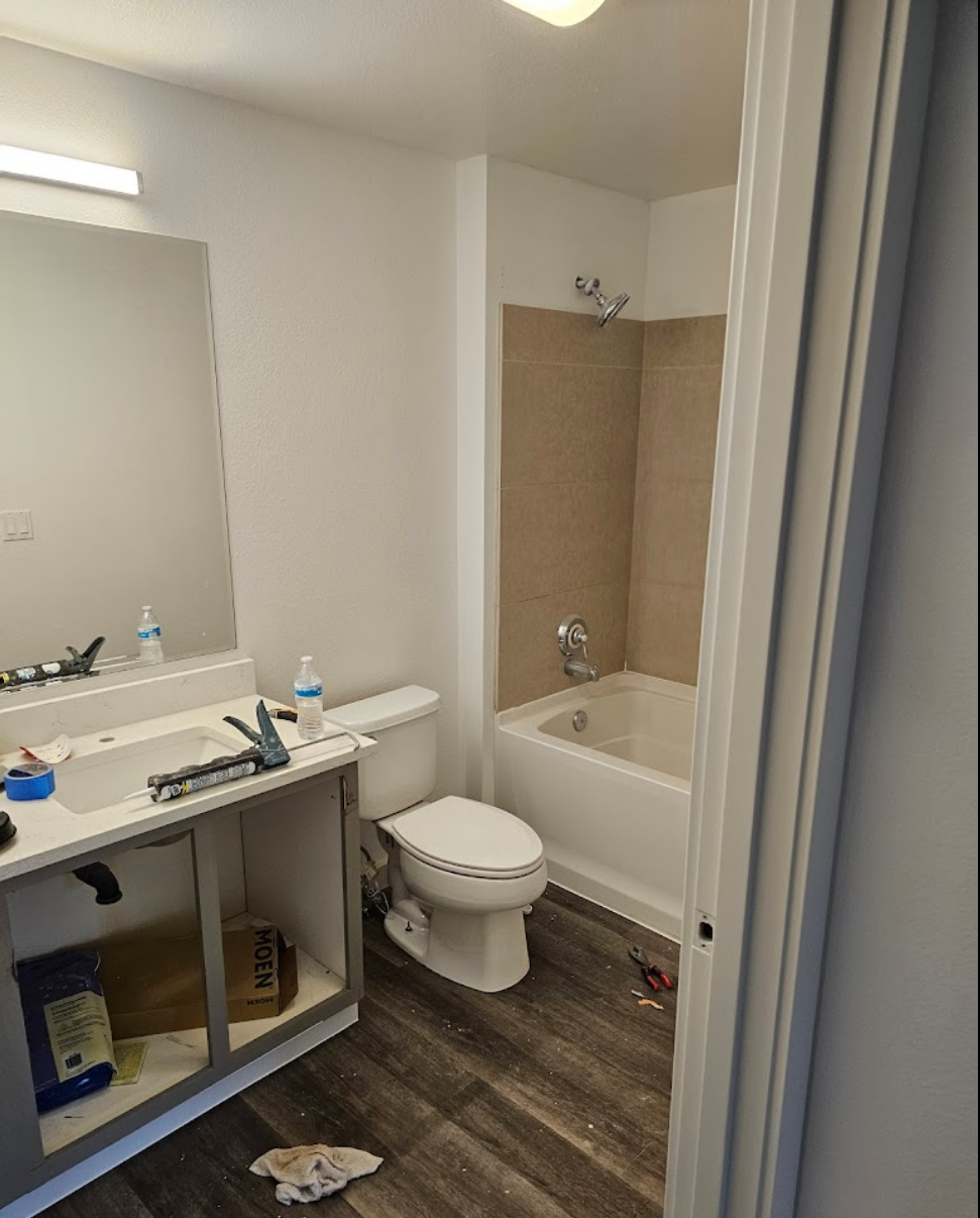 Bathroom remodel featuring updated vanity and flooring