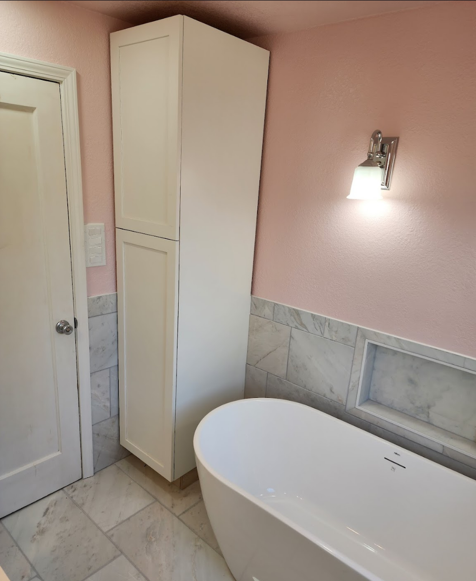 Bright bathroom with a freestanding tub and modern storage solutions