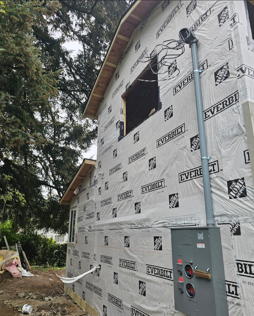 Rear view of ongoing remodelation with siding and insulation