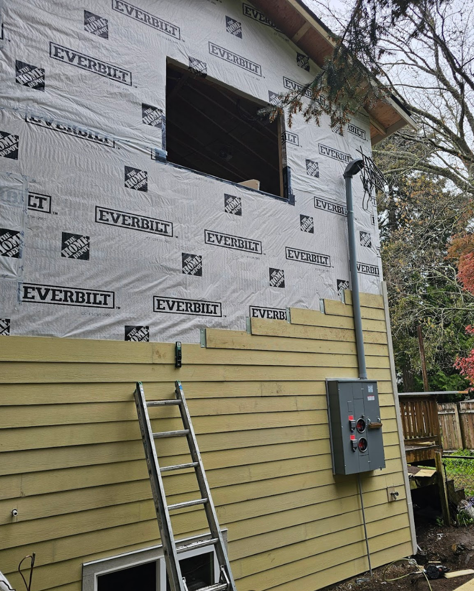 Partial view of home exterior with materials in place