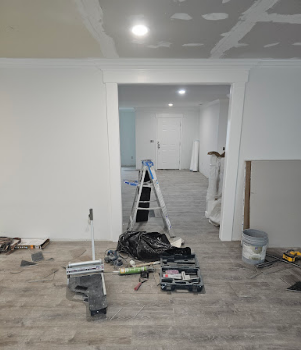 Spacious hallway featuring newly installed wood-style floors