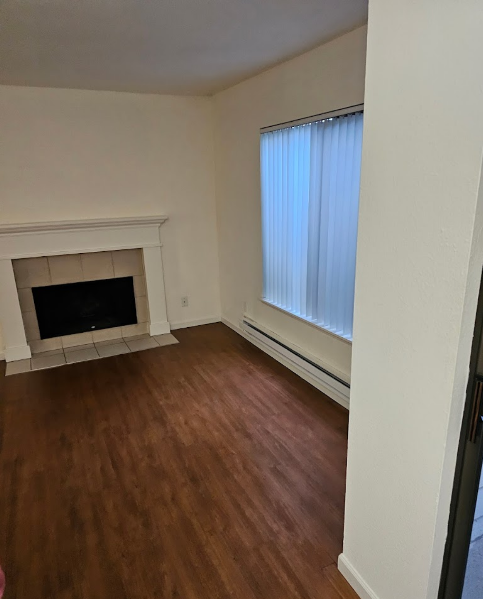 Bright living room featuring clean and polished wood flooring