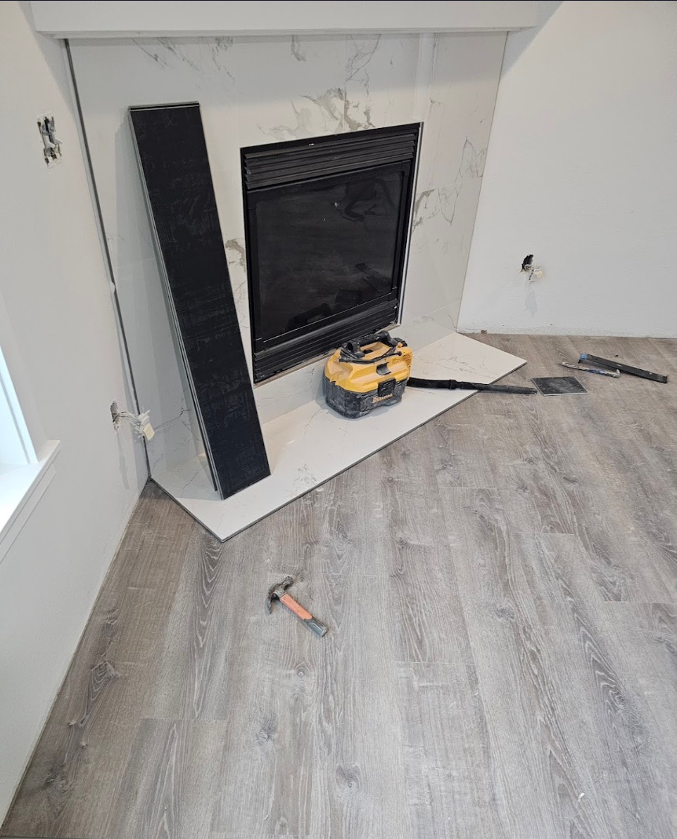 Modern fireplace installation in a new home addition with sleek flooring