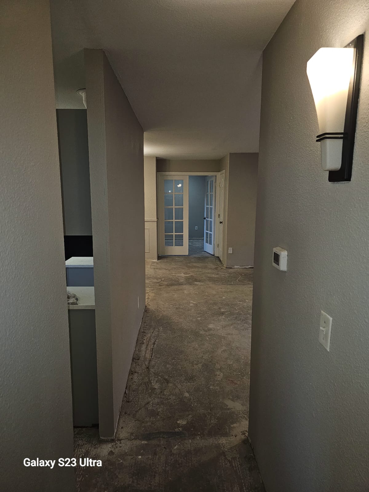 Renovated hallway leading to different rooms