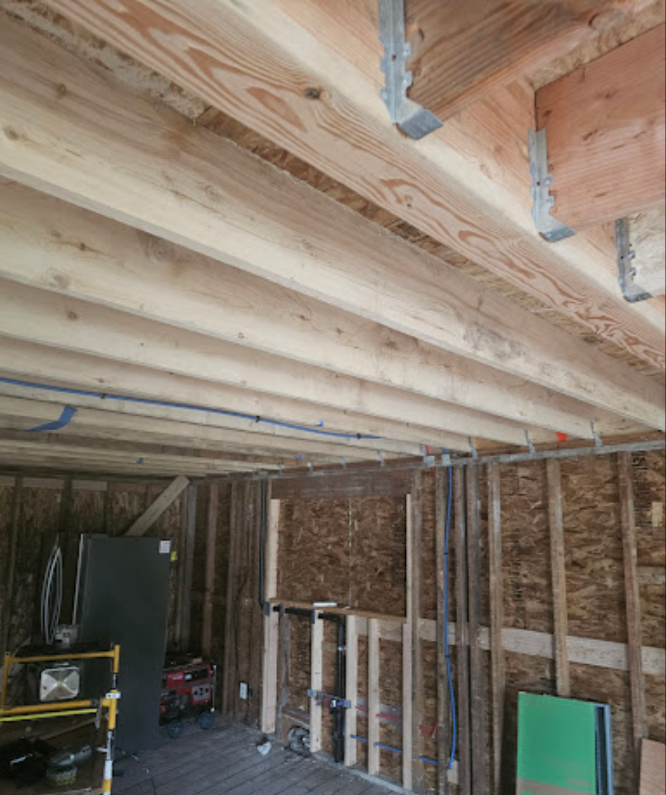 Open layout under construction with wooden beams