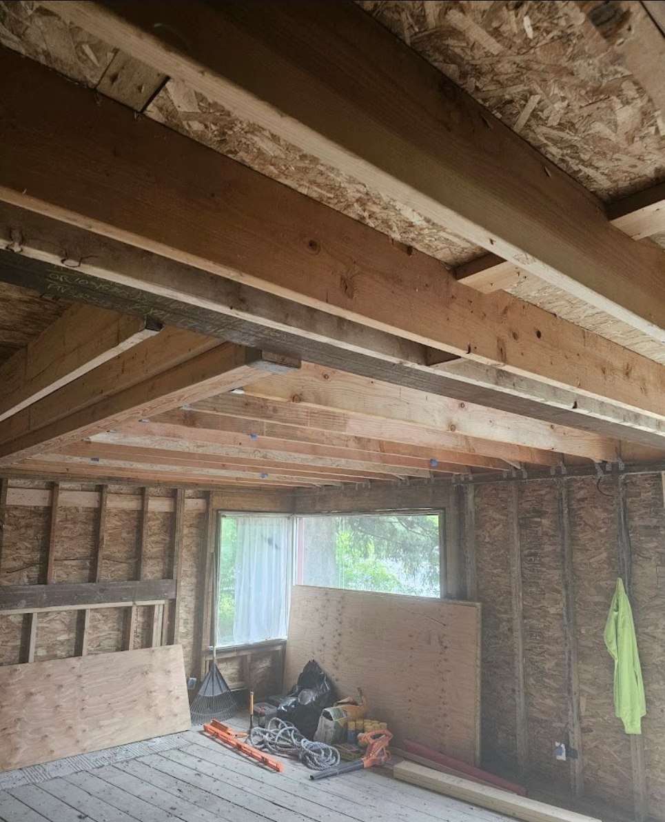 Interior remodeling showing framing and natural light