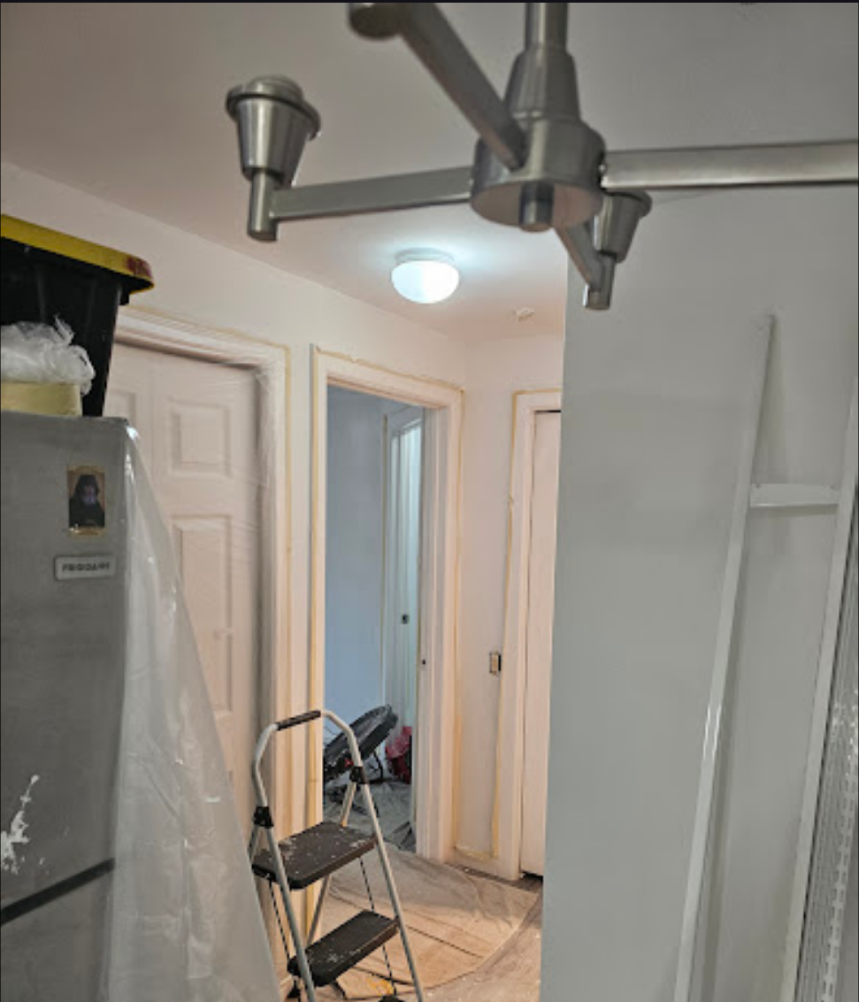 Hallway remodeling in progress with updated lighting