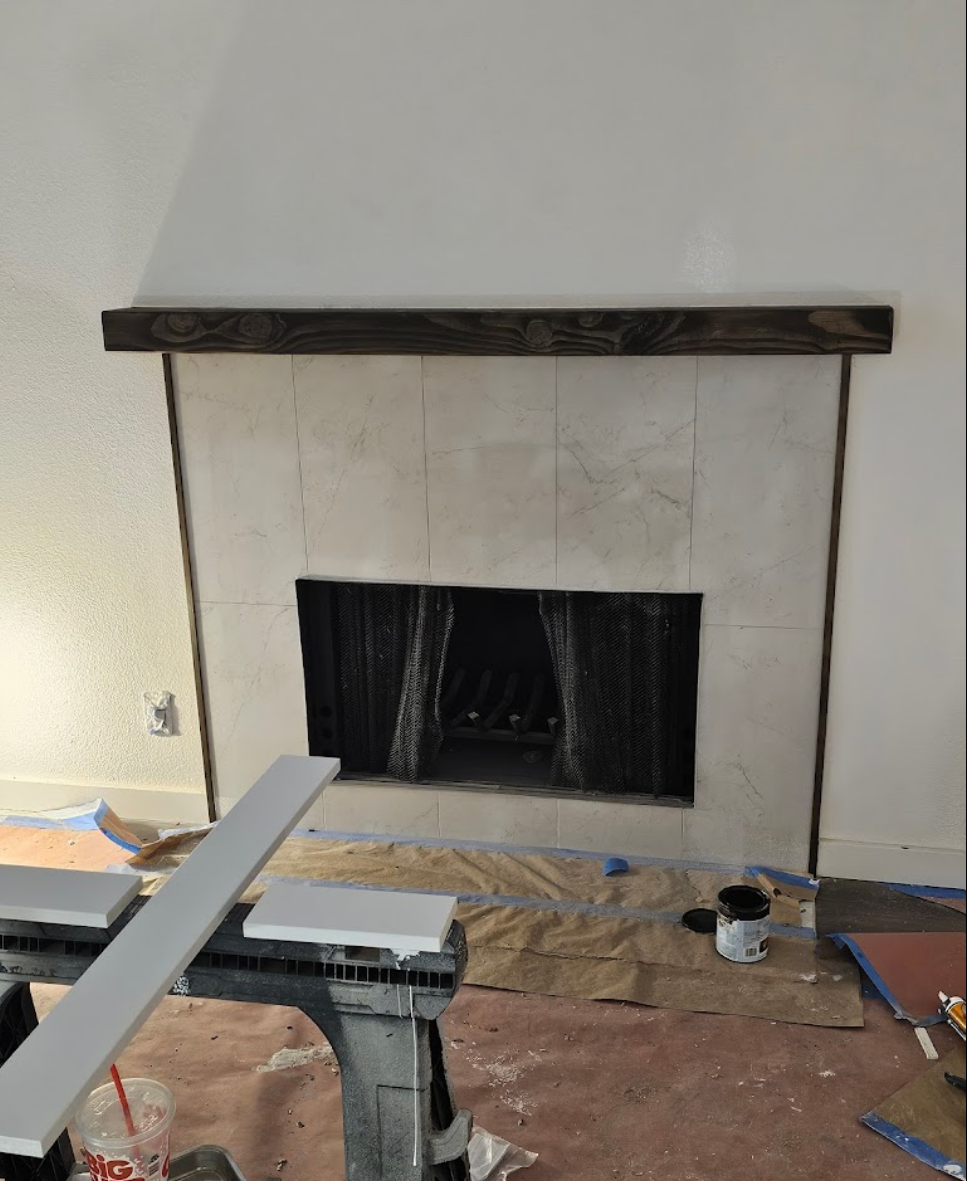 Fireplace remodeling in progress with updated materials