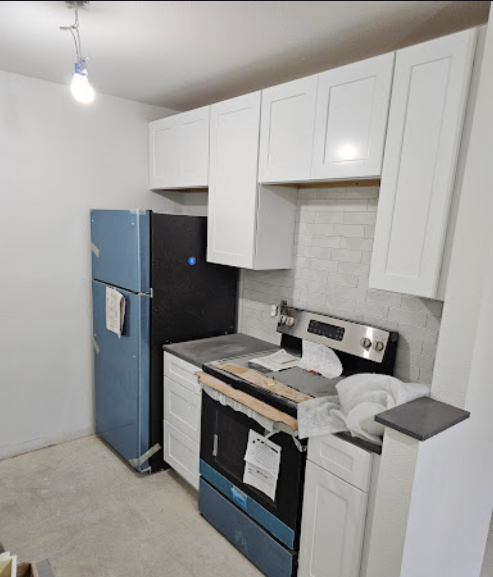 Compact white kitchen with modern appliances