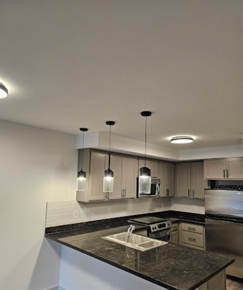 Elegant kitchen view with island and lighting