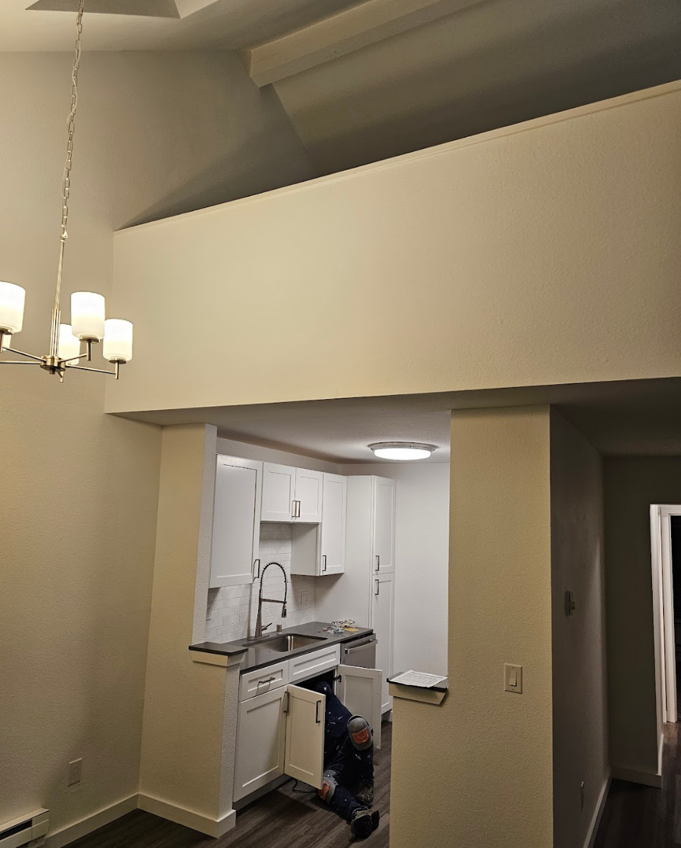 Small kitchen design featuring bright white cabinets and efficient layout.