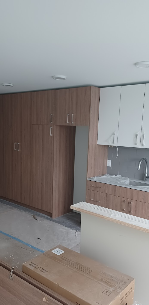 Bright and organized kitchen with wood and white finishes