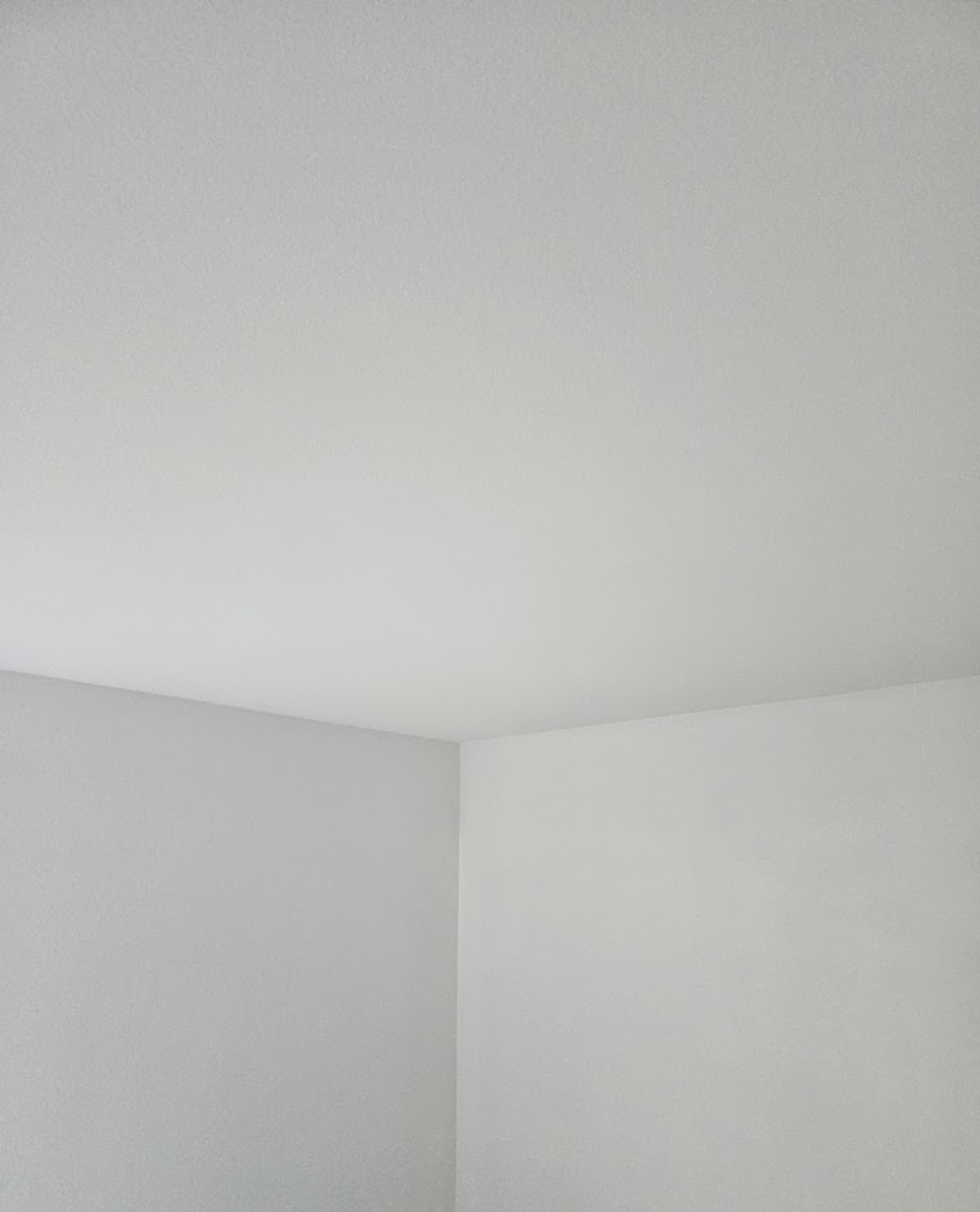 Freshly painted white ceiling and walls for a clean finish