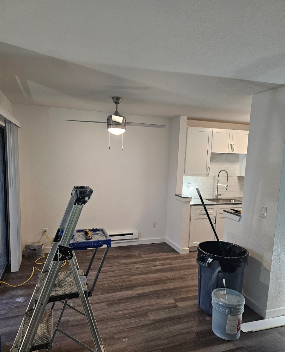 Dining and kitchen area undergoing a painting transformation