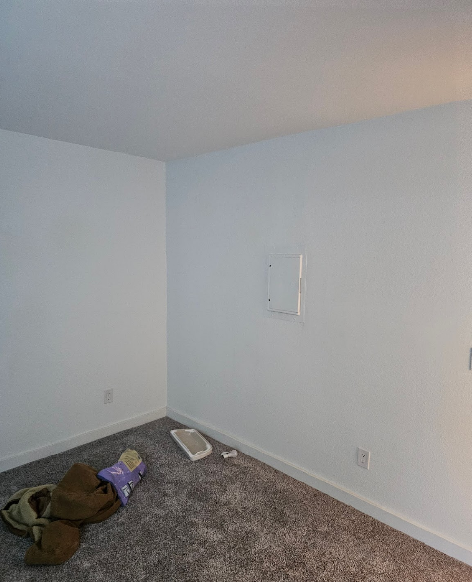 Bedroom walls painted in light tones, creating a calm and cozy atmosphere