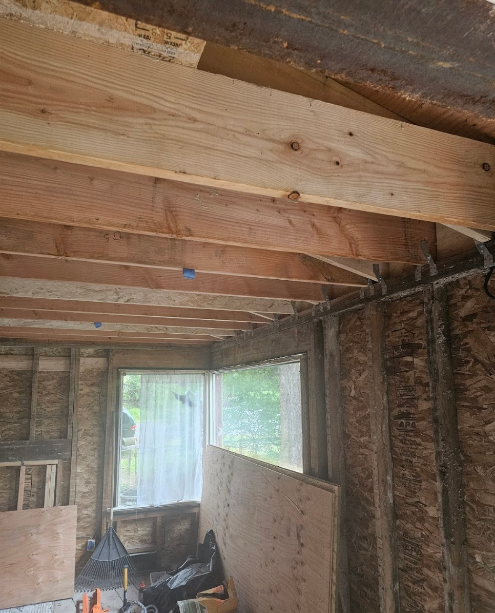 Installing new wooden planks for ceiling support